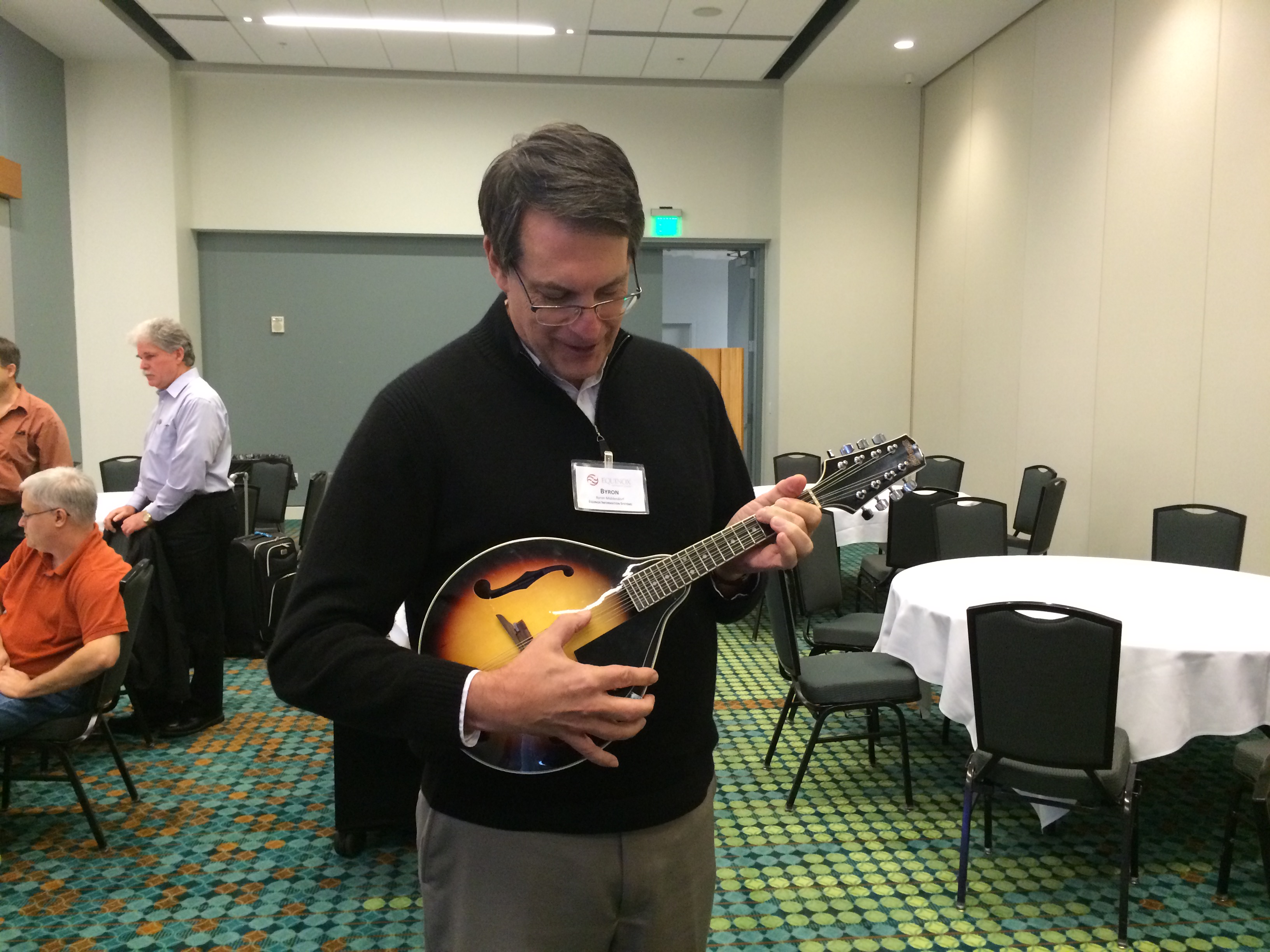 Our fearless leader strums a tune as the event winds to a close.