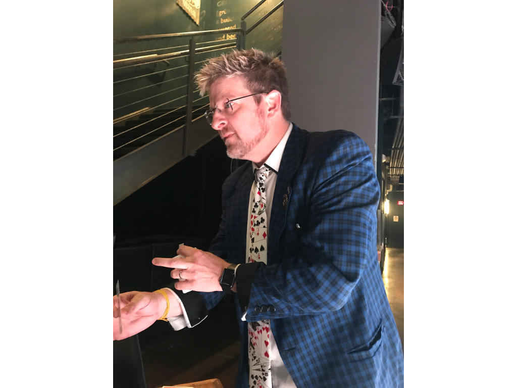 Magician Terry Hedges wows the group Tuesday night