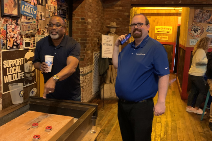 Ernest and Tom took part in the table shuffleboard competition